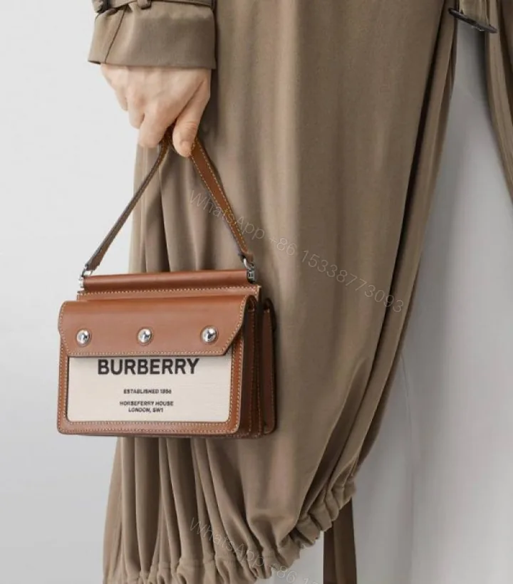 View 1 of First Copy Burberry Brown Structured Top Handle Bag With Logo Front Panel And Premium Finish