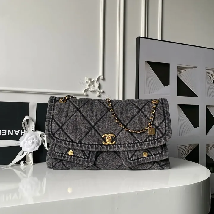 View 1 of Chanel Maxi Flapbag in washed denim with gold-tone metal hardware
