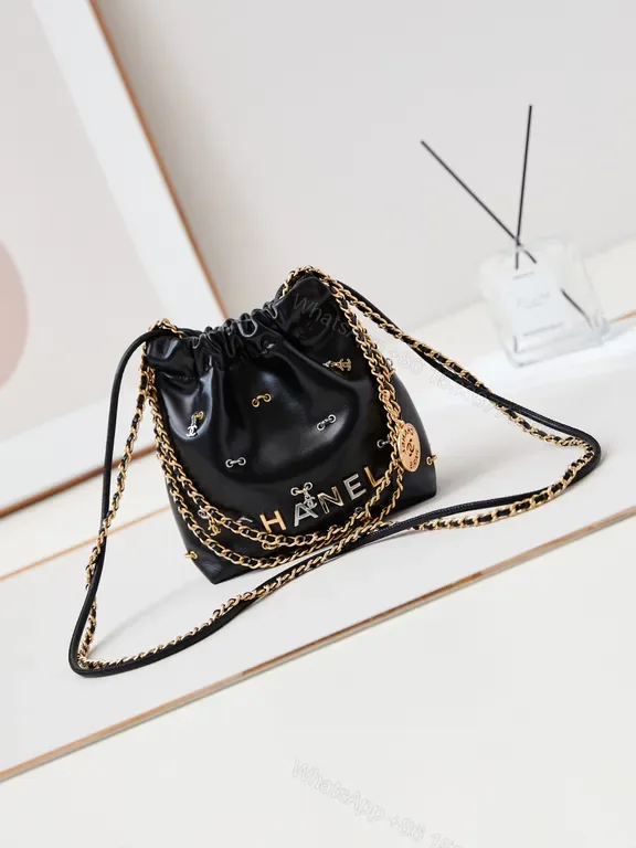 View 1 of Chanel-Inspired Mini Leather Drawstring Bag with Chain Detail