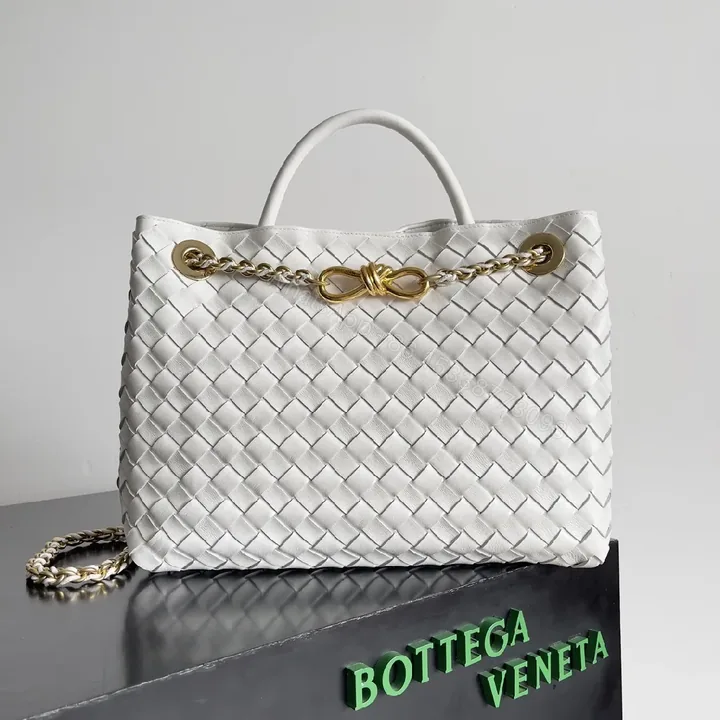 View 1 of White Faux Leather Tote with Gold Chain Accent, Woven Style Bag