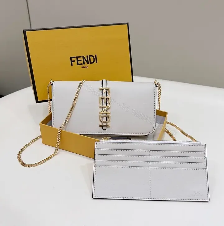 View 1 of Chic White Leather Satchel with Gold Chain Details
