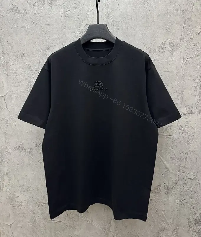 View 1 of Textured Logo Black Knit Tee – Oversized Luxury Streetwear
