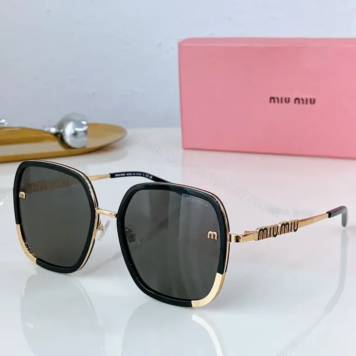 View 1 of Lux Black & Gold Rim Sunglasses with Miu Miu Hardware