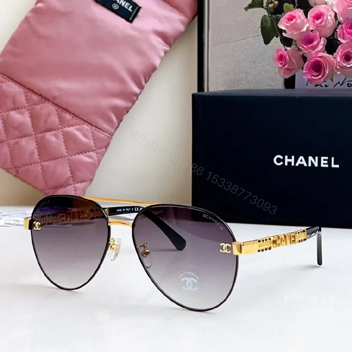 View 1 of Gold-Tone Aviator Sunglasses with Luxe Logo Details