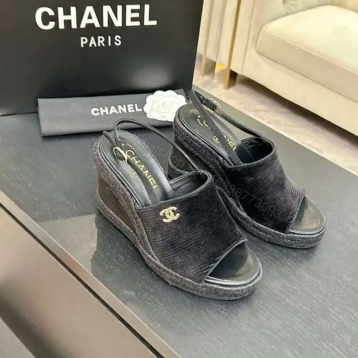 View 1 of Chic Black Textured Slingback Sandals with Gold Logo