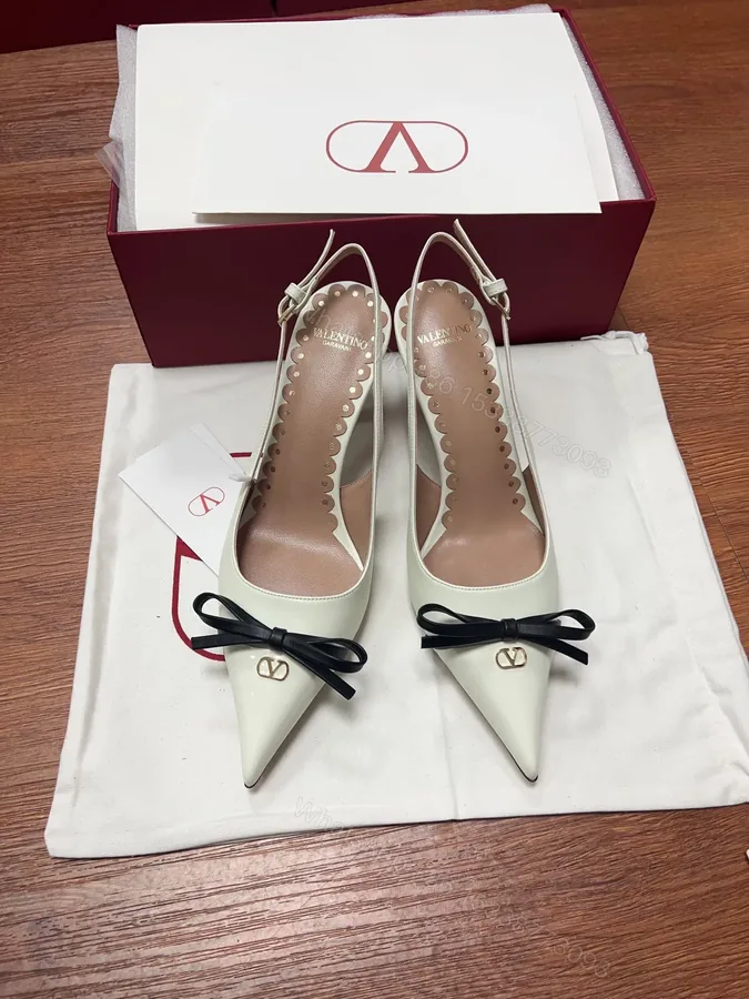View 1 of Valentino Women White Patent Leather Pointed Slingback Pumps