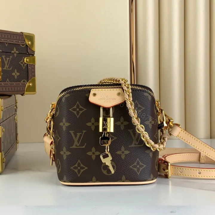 View 1 of Louis Vuitton Lv Just In Case Monogram Pattern Handbags 14x13x11cm