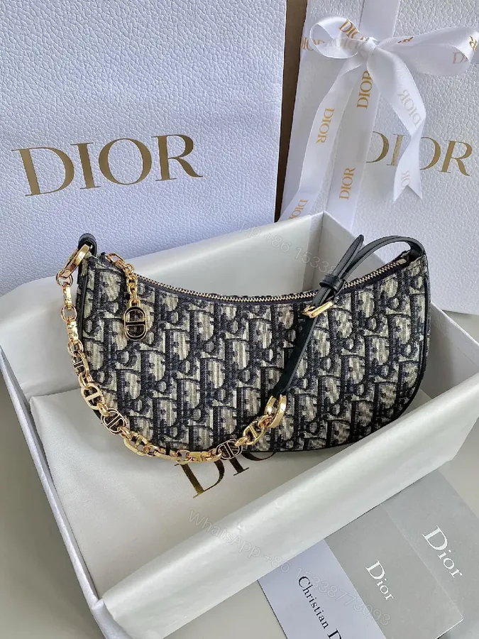 View 1 of Compact Monogram Bag: Gold Chain Accent, Leather Trim, Luxurious Compact Shoulder Bag