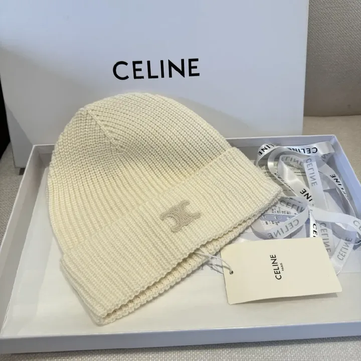 View 1 of Cream Knit Beanie + Ribbed Material + Minimalist Style + Subtle Monogram + Beanie