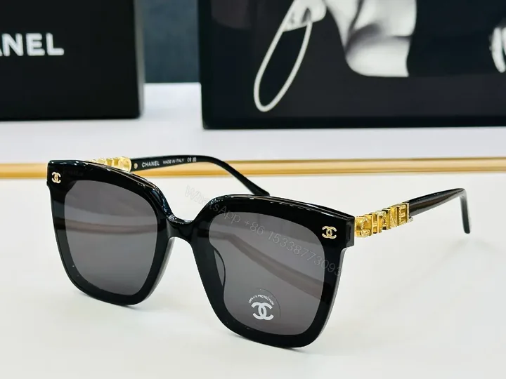 View 1 of Bold Black Frame Sunglasses with Gold Detailing