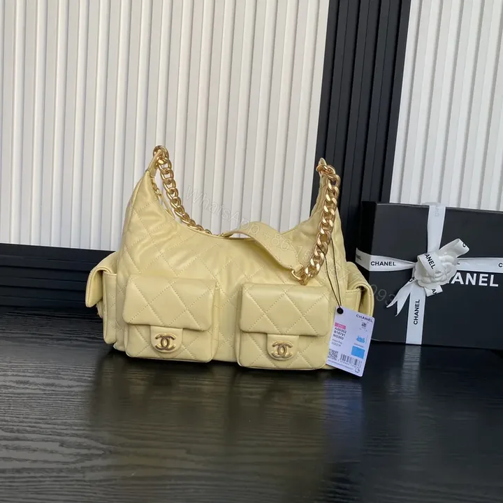 View 1 of Chic Quilted Weekender Bag in Soft Yellow with Gold Chain Handles