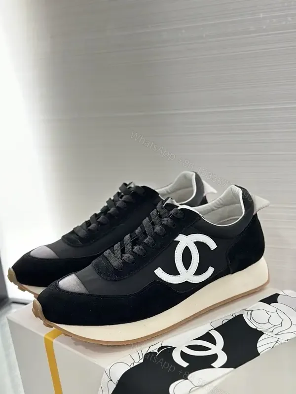 View 1 of Sleek Black Knit High-Top Sneaker with Signature Emblem, Luxury