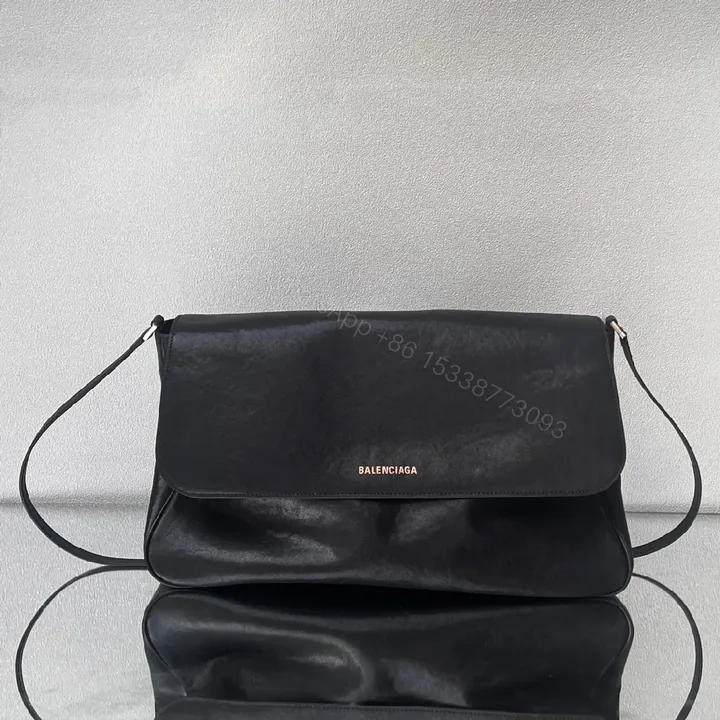 View 1 of Minimalist Black Leather Crossbody: Compact Luxury Bag