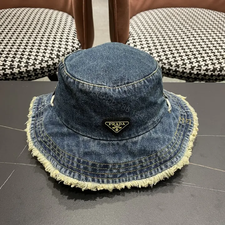 View 1 of Denim Bucket Hat + Distressed Edge + Modern Luxury + Subtle Prada-Inspired Badge + Hat