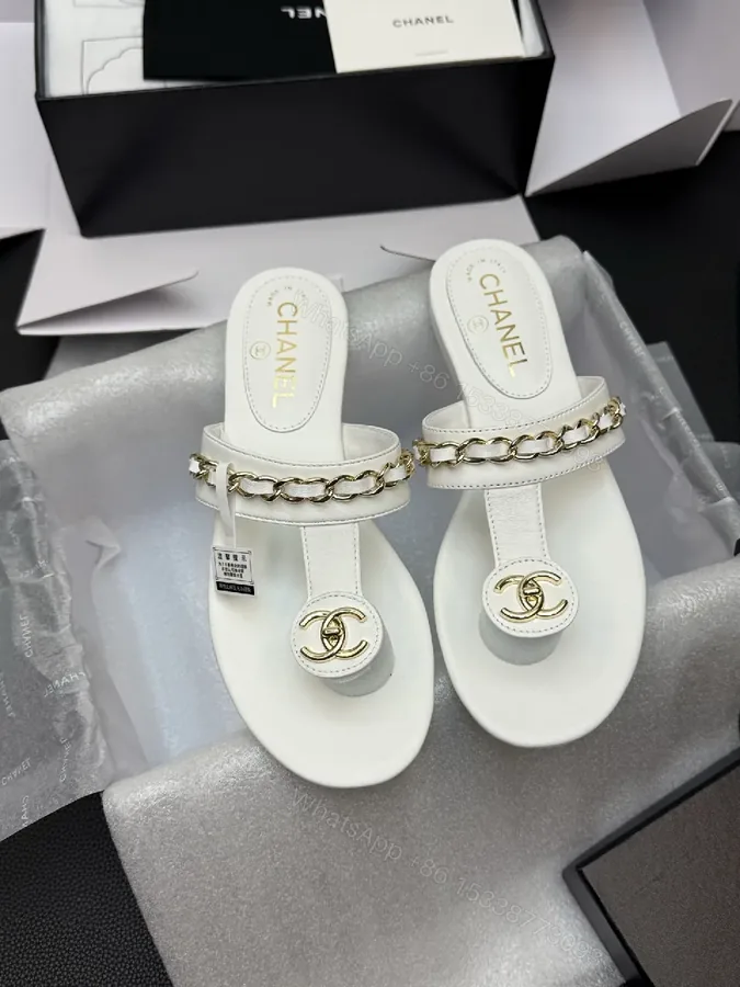 View 1 of Elegant White Leather Sandals with Gold Chain Accent