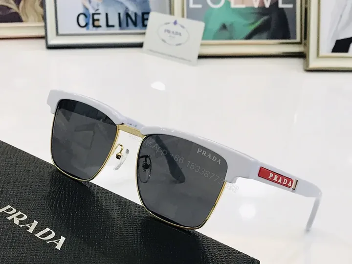 View 1 of White Prada Sunglasses: Gold Trim, UV400 Lenses, Luxury Acetate Frame