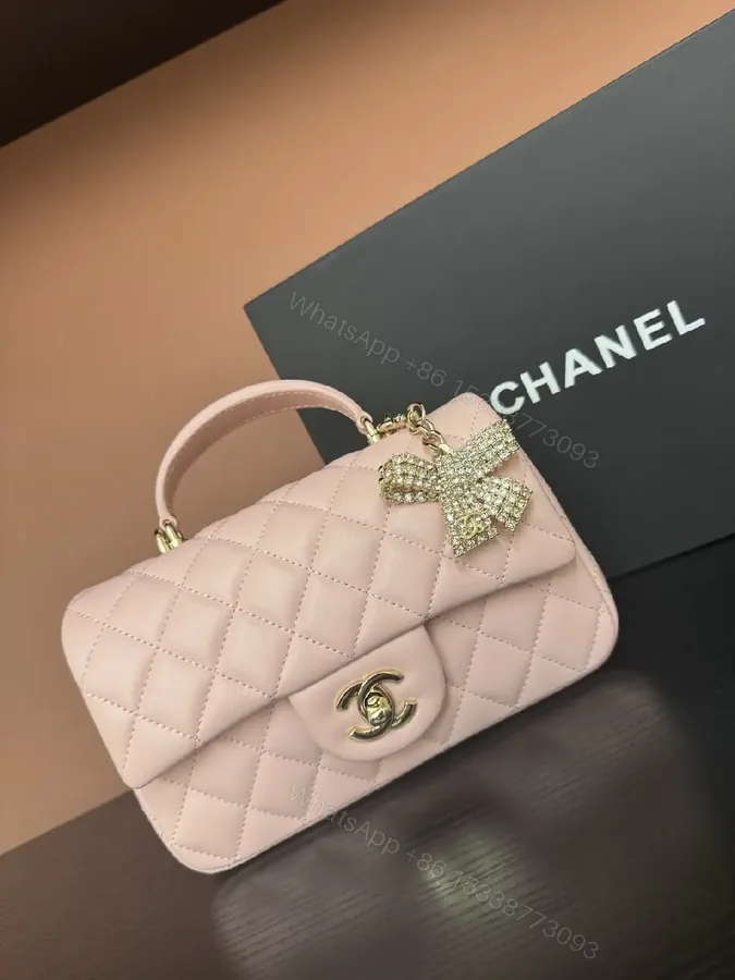View 1 of Pink Quilted Mini Flap Bag with Crystal Bow Accent (No Brand)