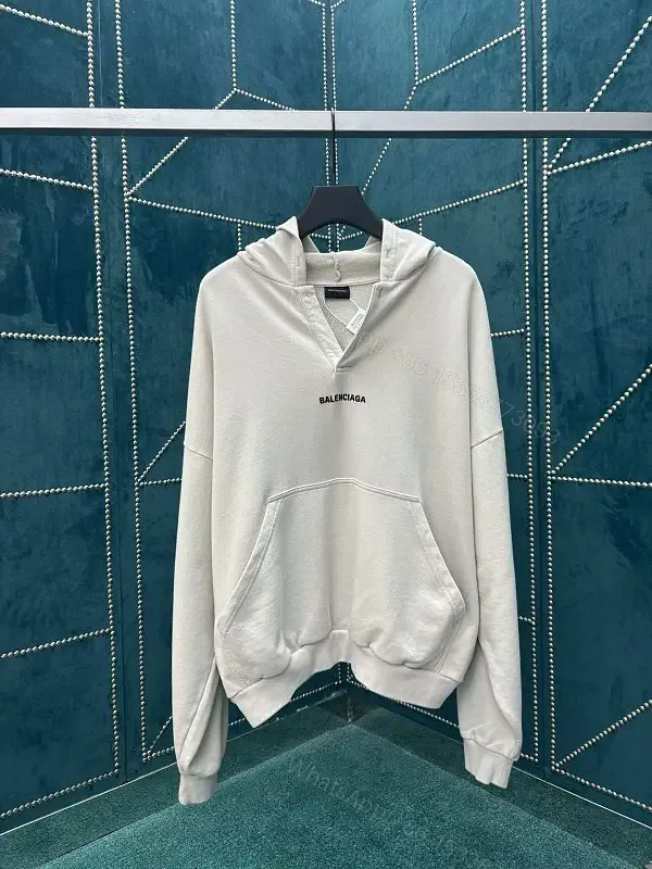 View 1 of Neutral Cotton Blend Minimalist Hoodie with Subtle Logo (Unisex)