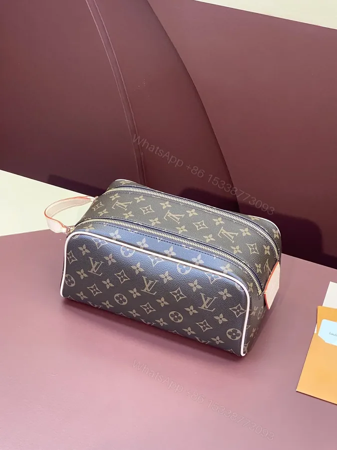 View 1 of Louis Vuitton Dopp Kit Toilet Pouch in Monogram Canvas