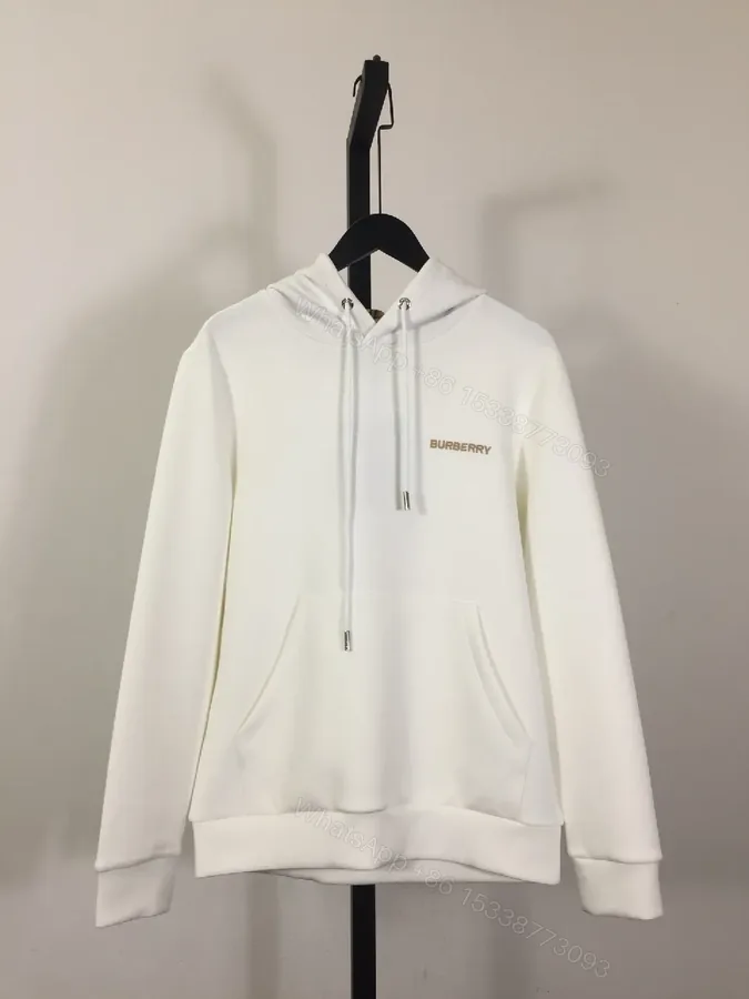 View 1 of Minimalist Off-White Hoodie with Subtle Logo Design