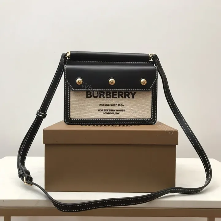 View 1 of Beige Canvas & Black Leather Crossbody: Bold Brand Duo
