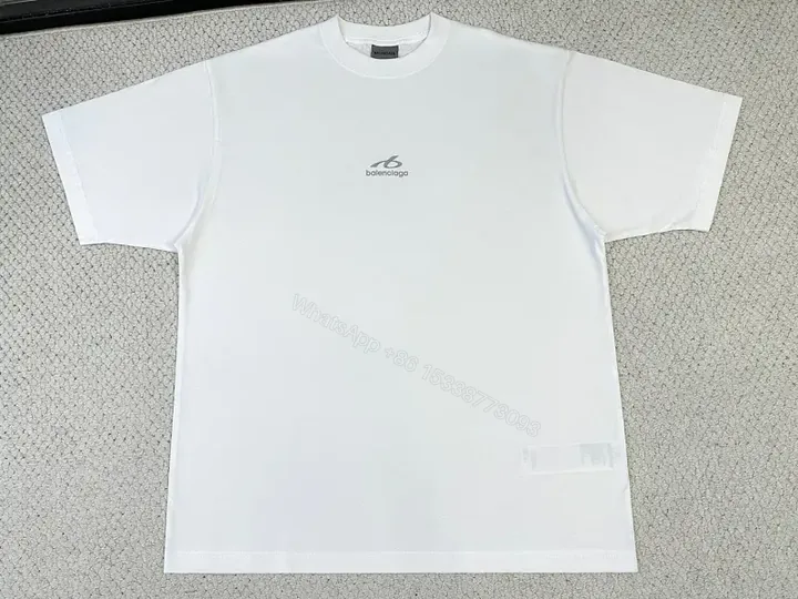 View 1 of White Cotton Minimalist T-Shirt with Balenciaga Logo