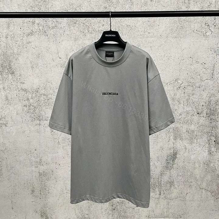 View 1 of Neutral Cotton Oversized Tee: Minimal Logo, Elevated Comfort
