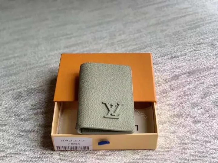View 1 of Sage-Grain LV Card Holder: Subtle Signature, Slim Portability