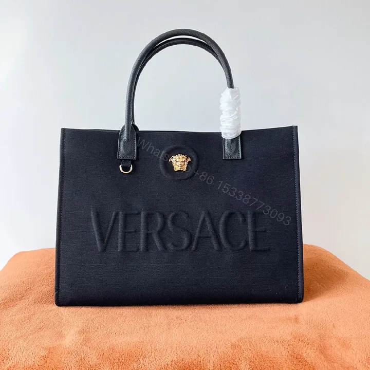 View 1 of Structured Sophistication Tote: Black, Matte Shell, Modern Luxury, Gold Hardware