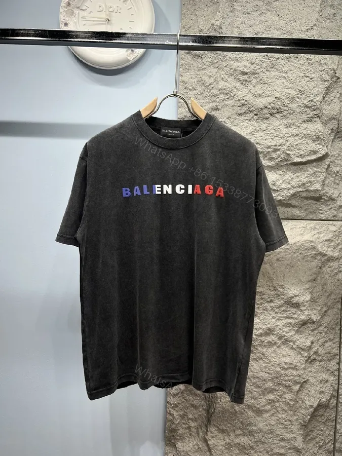 View 1 of Vintage Black Logo Tee | Soft Cotton Blend, Oversized Fit, Distressed Seamless