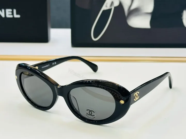 View 1 of Chic Black Cat-Eye Sunglasses with Gold Detailing