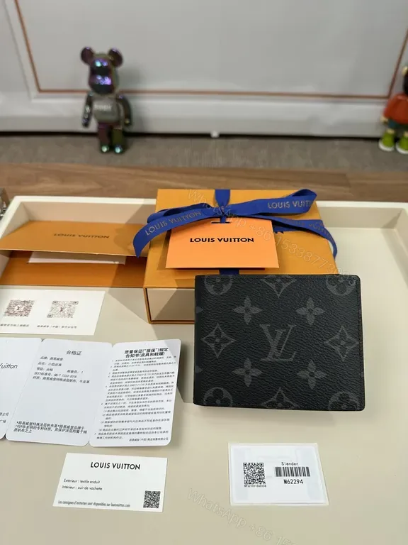 View 1 of Compact LV Monogram Wallet: Signature Texture, Everyday Luxury