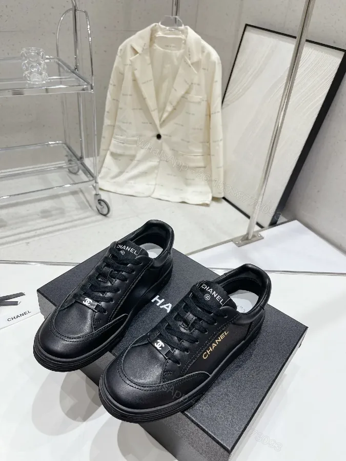 View 1 of Black Leather Sneakers: Subtle Branding, All-Day Comfort
