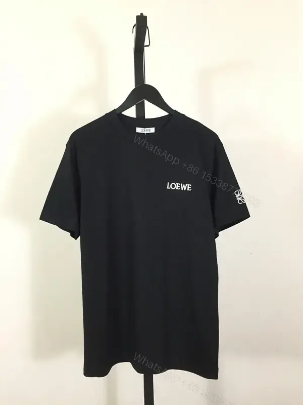 View 1 of Minimalist Black Tee: Subtle Branding, Everyday Luxury Tee