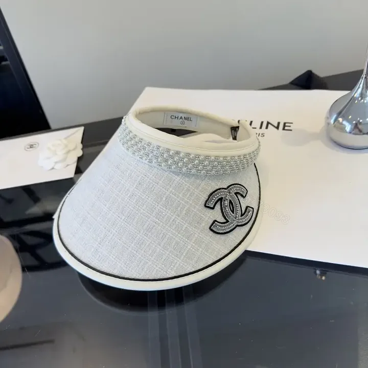 View 1 of Light Gray Linen Visor Cap with Rhinestone Collar and Chanel Logo