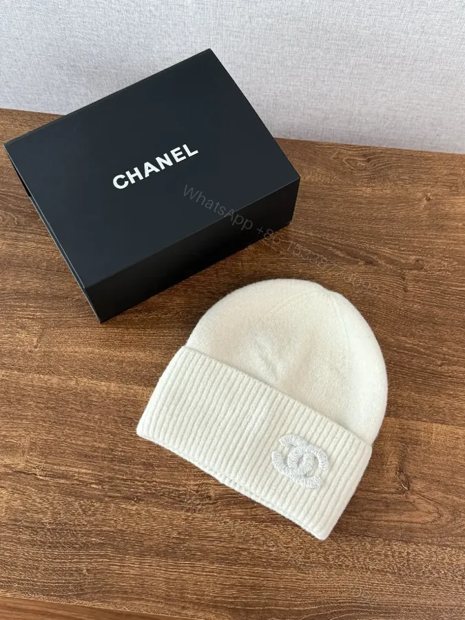 View 1 of Chic Minimalism Beanie: Off-White Knit, Embroidered Logo, Everyday Luxury