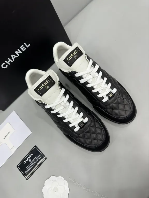 View 1 of Chanel-Quilted Leather High-Top Sneakers with Signature Details