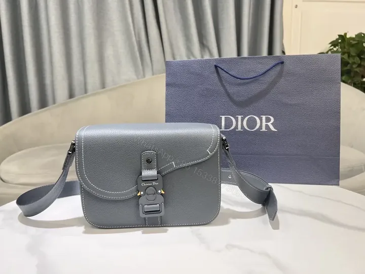 View 1 of Gray Leather Crossbody: Compact Luxury with Signature Clasp