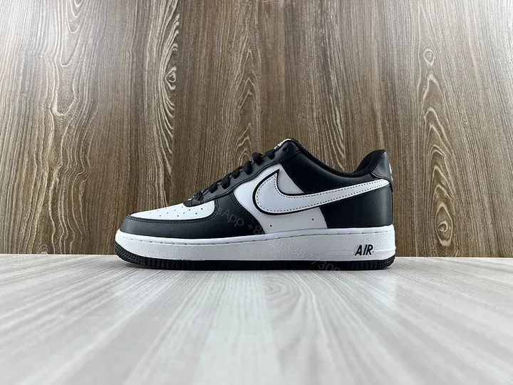 View 1 of Black Leather Low-Top Sneakers with Signature Swoosh
