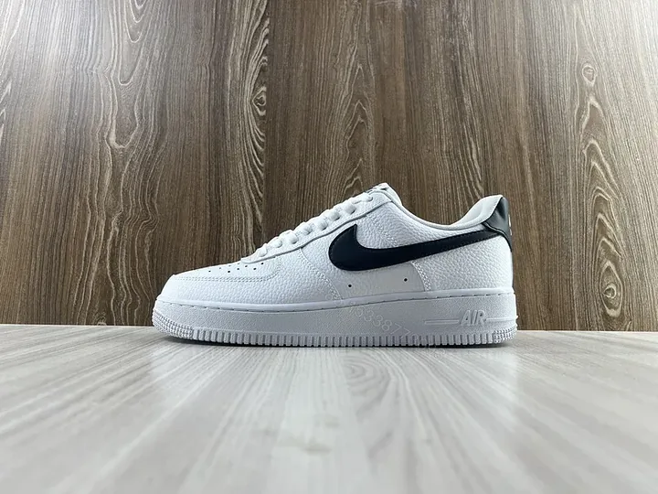 View 1 of White Leather Sneaker + Leather + Minimalist + Bold Swoosh + Classic Air Force Style
