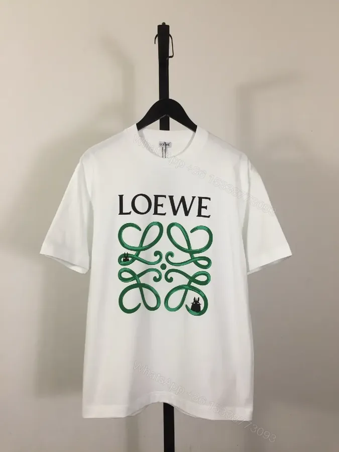 View 1 of White Cotton Graphic Tee – Opulent Comfort, Bold Logo, Casual Luxury