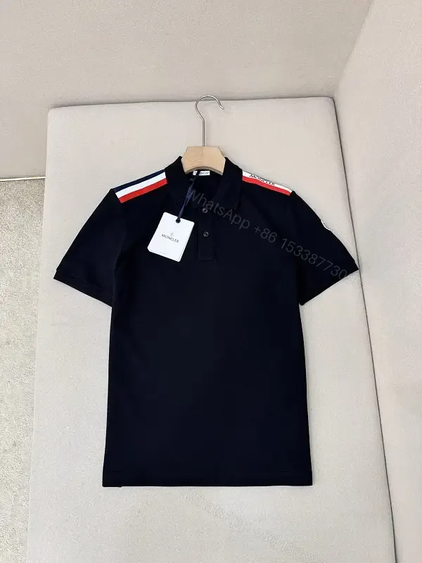 View 1 of Navy cotton polo shirt with red-white striped shoulder accents for everyday luxury
