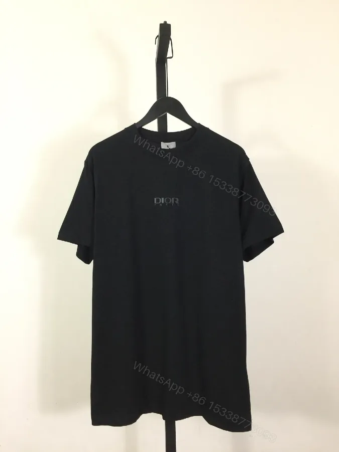 View 1 of Minimalist Black Tee Dress: Subtle Dior Branding, Versatile Style