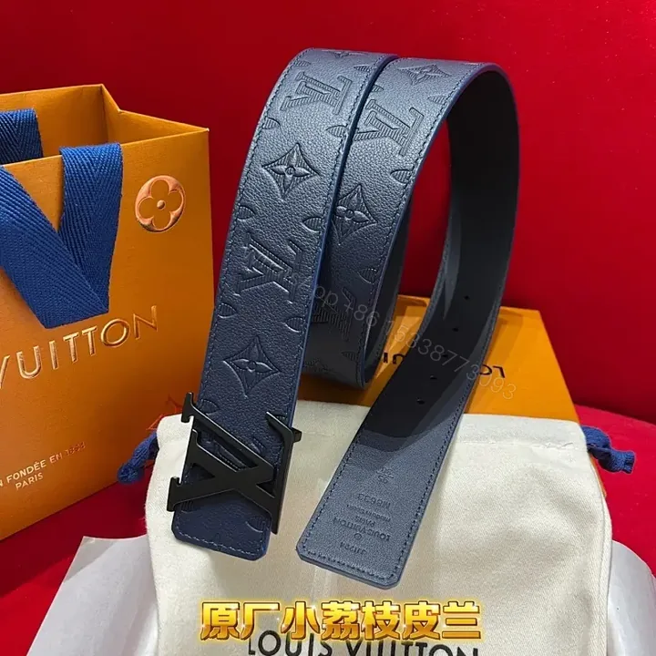 View 1 of Blue Embossed Monogram Belt: Luxe Everyday Accessory