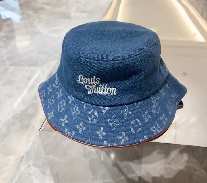 View 1 of Denim Bucket Hat with LV Monogram Accents - Modern Texture