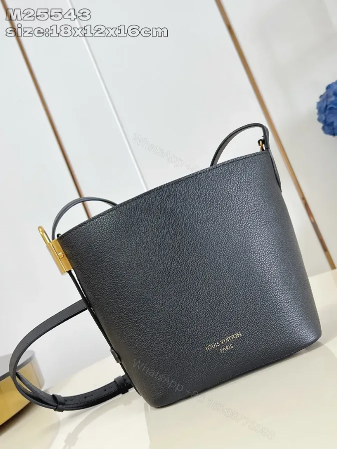 View 1 of Polished Grain Leather Bucket Bag with Gold Hardware, Minimalist Style, Everyday Carry