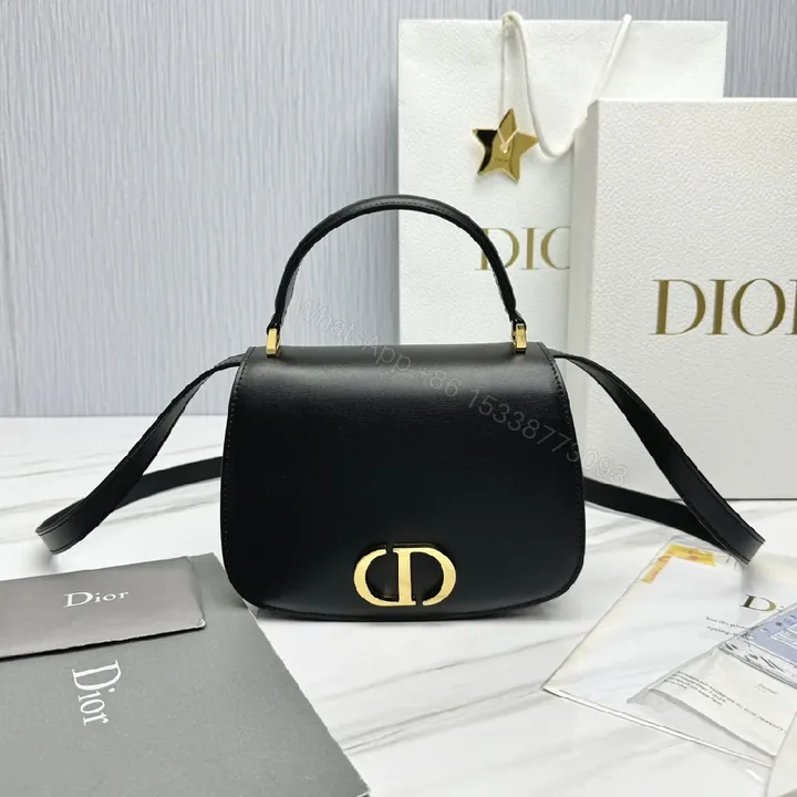 View 1 of Chic Black Leather Saddle Bag with Gold Hardware