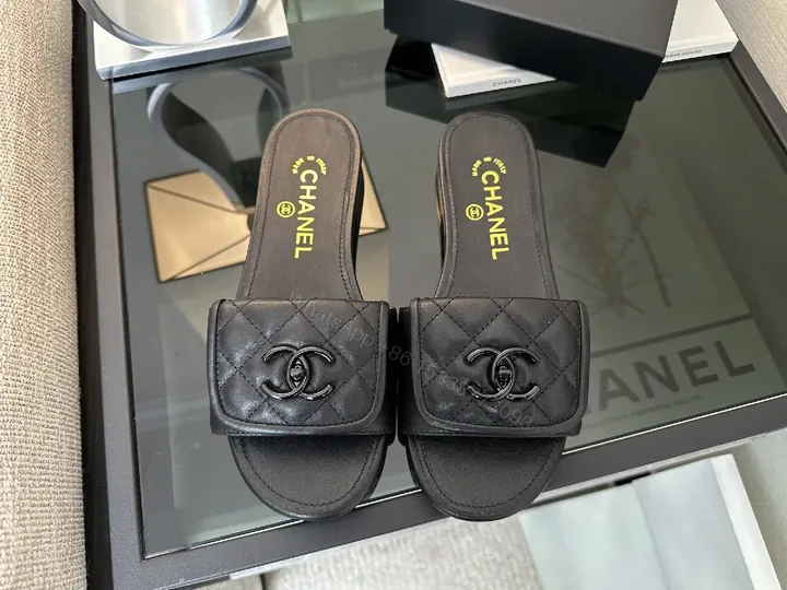 View 1 of Chic Black Quilted Slides with Logo Detailing