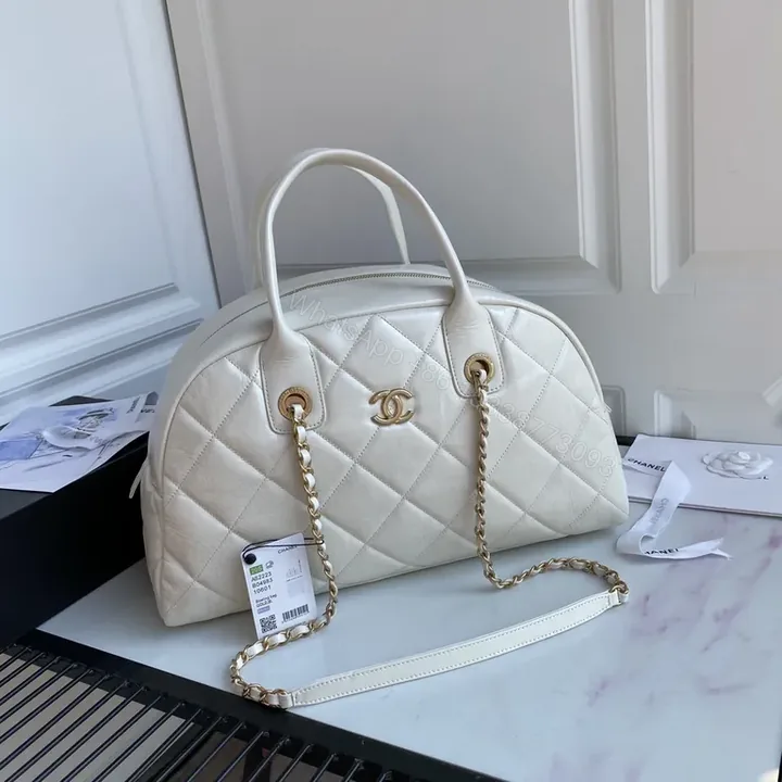 View 1 of White Quilted Weekend Bag: Gold Chain, CC-Inspired Luxury