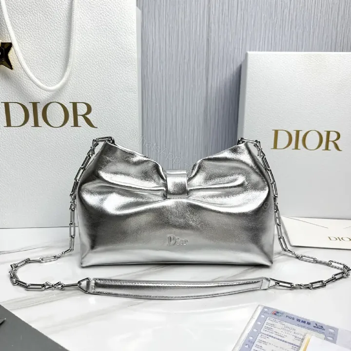View 1 of Shimmer Metallic Bow Crossbody: Luxe Compact Crossbody Bag